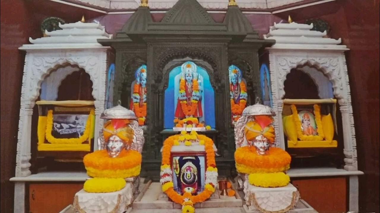 Golden-accented Shri Ram Mandir in Shegaon, housing idols of Lord Ram, Sita, and Lakshman above the Samadhi