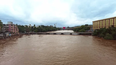 Polluted stretch of Mula-Mutha River with plastic waste