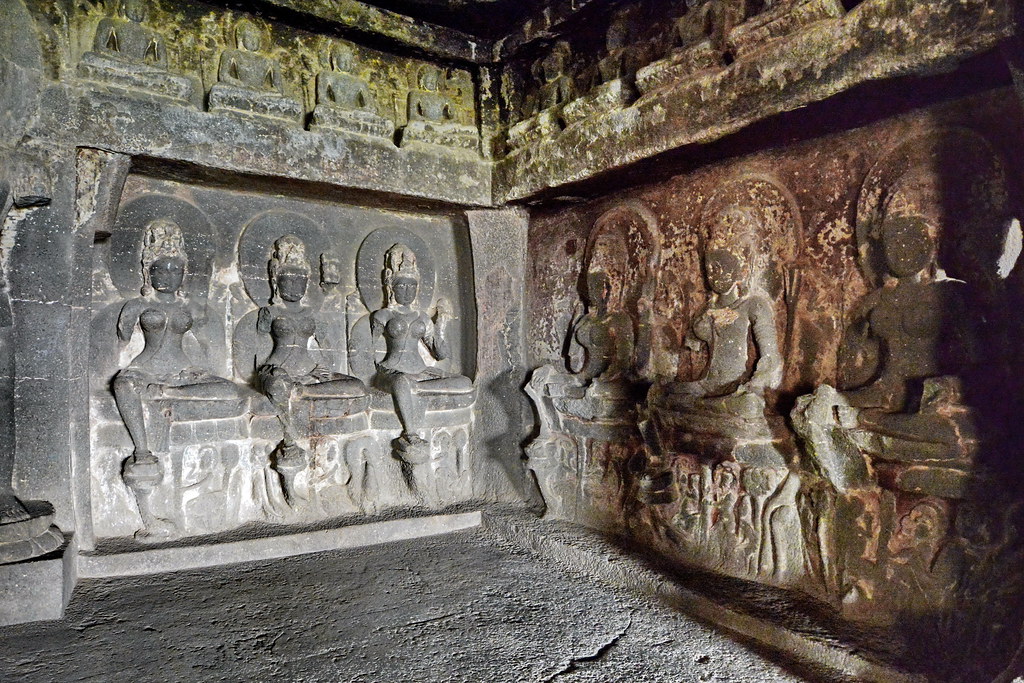 Interior of Kailasa Temple at Ellora Caves in India with carved pillars and deities