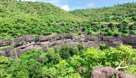 Panoramic view of India Ajanta Caves carved into the cliffside