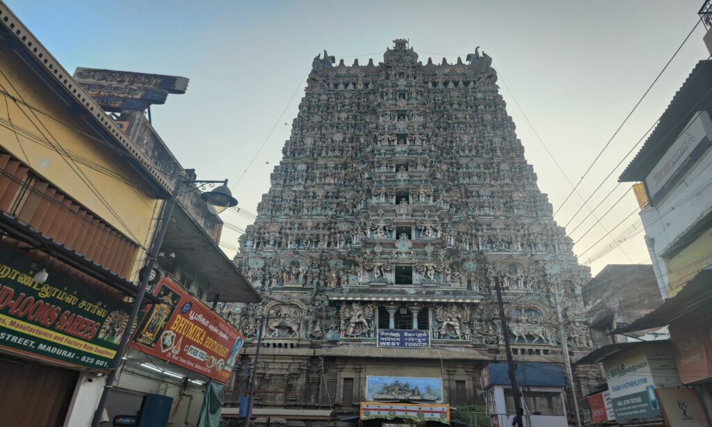 Meenakshi Temple gopuram with colorful sculptures in Dravida style