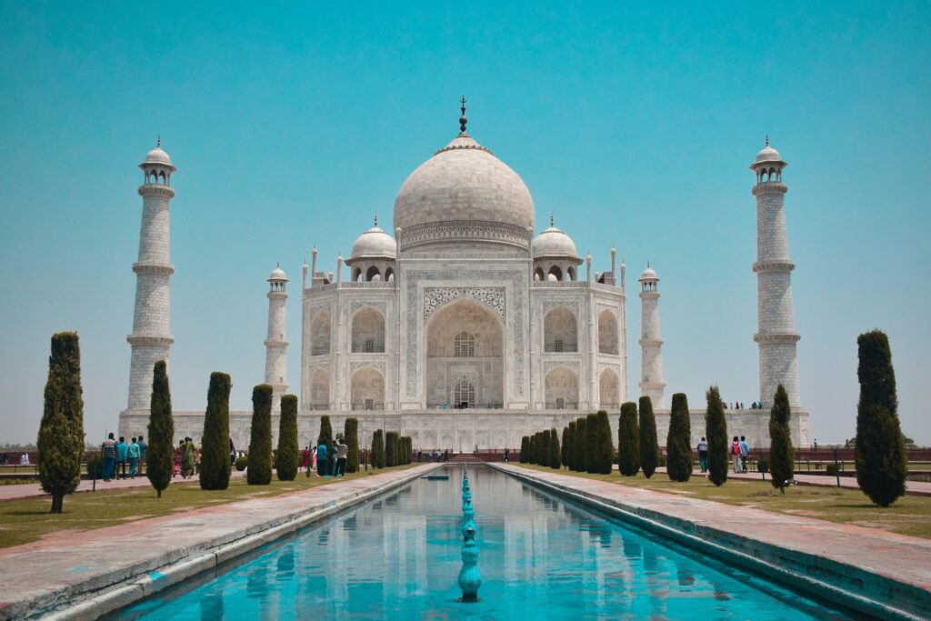 UNESCO World Heritage Sites in India: A Complete Guide to Cultural, Natural, and Mixed Heritage (2025) 2 Taj Mahal glowing at sunrise, its iconic white marble reflected in the garden pool
