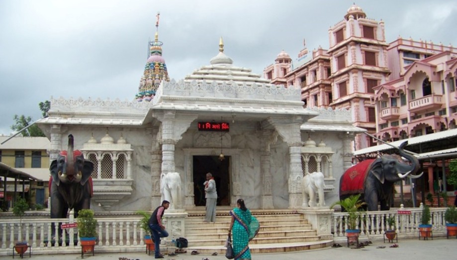 Balumama Temple exterior: The marble entrance of Shri Balumama Temple in Adamapur, Maharashtra, flanked by stone elephant statues