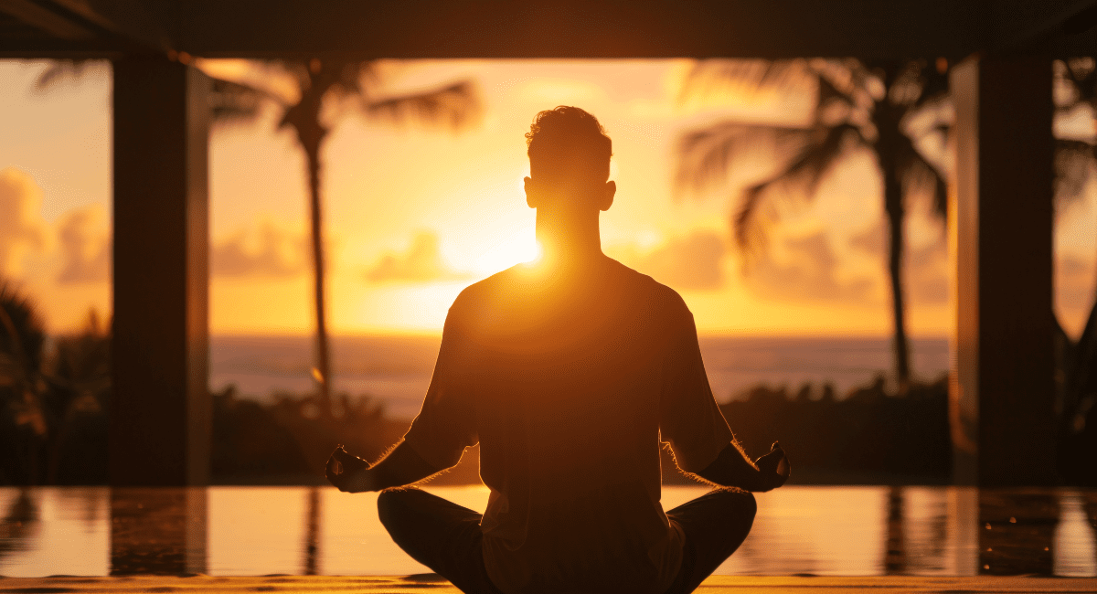 Woman sitting in comfortable meditation position demonstrating how to start daily meditation practice for beginners
